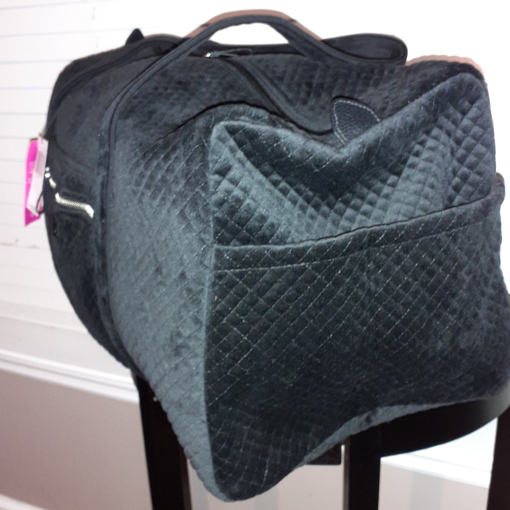 Large iconic black duffle bag.